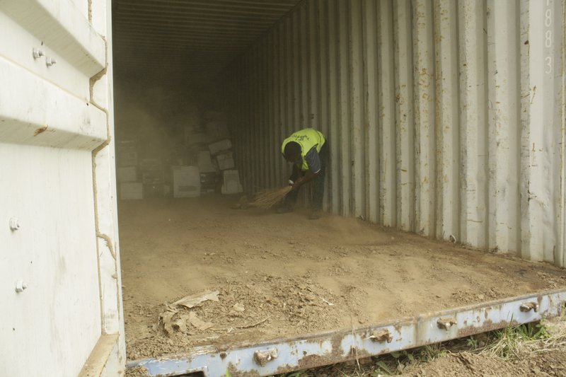 Prepare e-waste container, clearing out mess from termites